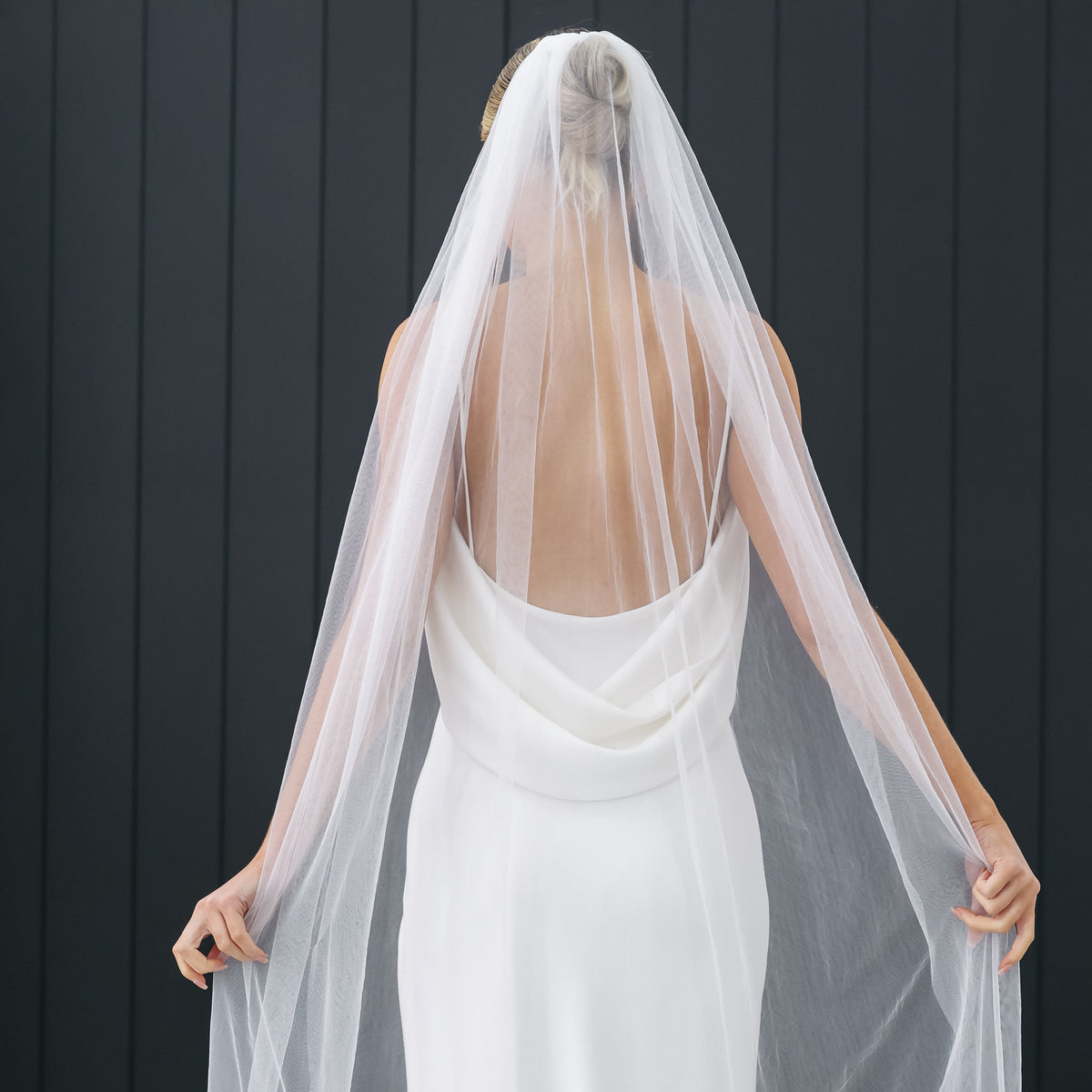 The sheer Isla veil showing the back of an ivory wedding dress